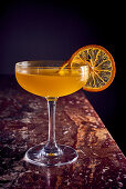 Cocktail with dried orange slice