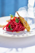 Beetroot spaghetti with anchovies
