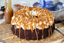 Chocolate wreath cake with salted pretzels and caramel