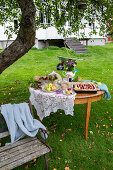 Cake buffet in the garden under the fruit tree