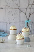 Carrot cupcakes with cream cheese and chocolate eggs