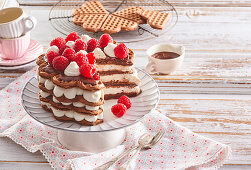 Chocolate wafer cake with cream and raspberries