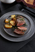 Roast beef steak with rosemary potatoes