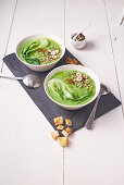 Creamy broccoli soup with paksoi and nuts