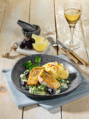 North German pikeperch with savoy cabbage and blue grapes