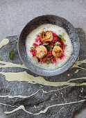 Fried scallops on beetroot sauerkraut with chilli