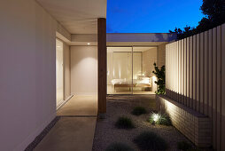 Modern designed patio with lighting and view into the bedroom