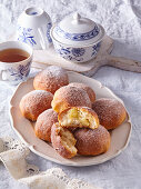 Apple and yeast dough balls with icing sugar