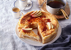 Baked rice pudding casserole with apple slices and cinnamon