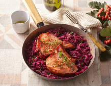 Roasted pork chops with beer sauce and red cabbage