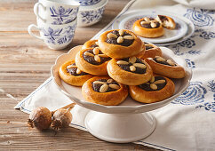 Yeast pastry with poppy seed filling and almonds