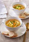 Vegetable soup with potato gnocchi, carrots and peas