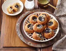 Round Moravian yeast rolls with quark and plum filling