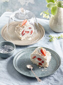Meringue roll with strawberries and whipped cream