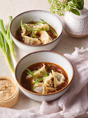 Asian lamb dimsum in a spicy ginger sauce