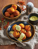 Baked potato dumplings with vanilla sauce and sultanas