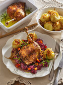 Crispy leg of goose with red cabbage and pumpkin