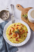 Saffron risotto with prawns and pomegranate seeds