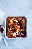 Self-saucing pudding with mulled wine and oranges