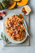 Pumpkin and chanterelle pasta with sage leaves and figs