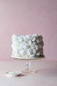White cake with edible paper decoration