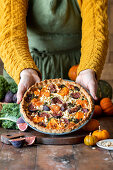 Pumpkin and fig tart with nuts and herbs