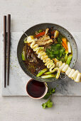 Odeng soup with king oyster mushrooms and fish cake skewers