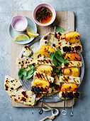 Grilled halloumi and peach skewers with yoghurt and thyme dip and pita bread