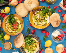 Hummus variations with fresh herbs and flatbread