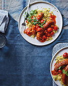 Merguez sausage with harissa tomatoes and couscous