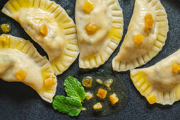 Pierogi with sauerkraut and mushroom filling and vegan butter