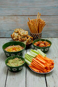 Vegan dips with puff pastry buns, grissini and vegetable sticks