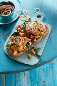 Toasted bread with nut butter, chanterelles and sage
