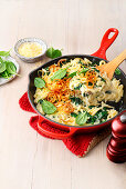 Cheese spaetzle with fried onion crunch, cream sauce and spinach