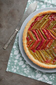 Rhubarb tart on plate with knife