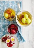 Two kinds of brine eggs with turmeric and beetroot