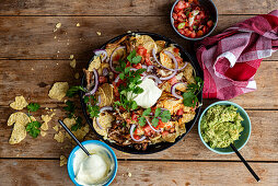 Classic nachos with guacamole and sour cream