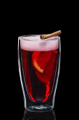 Mulled wine with orange slices and cinnamon stick