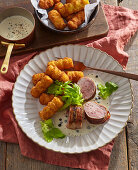 Pork fillet with pepper sauce and croquettes