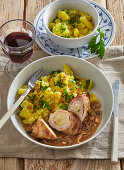 Pork roulades with sauerkraut filling and potato salad