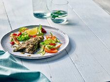 Fish fillet with herb crust and salad