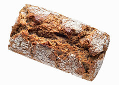 Loaf of bread with grains in a wicker basket