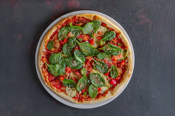 Pizza with ham, spinach, chard, parmesan and mushrooms