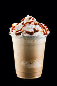 Caramel milkshake with whipped cream and caramel syrup