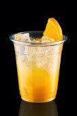 Orange cocktail with ice and orange slice