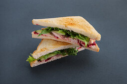 Club sandwich with smoked duck breast and redcurrant sauce