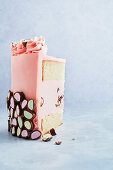 Pink layer cake with chocolate decoration