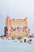 Pink layer cake with chocolate decoration