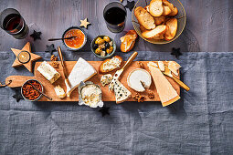 Cheese platter with various cheeses and garnishes