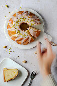 Lemon cake with icing and pistachios